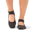 Woman stretching in a Dubai yoga studio wearing Aya Anthracite grip socks