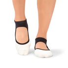 Woman stretching in a Dubai yoga studio wearing Aya Midnight Ombre grip socks