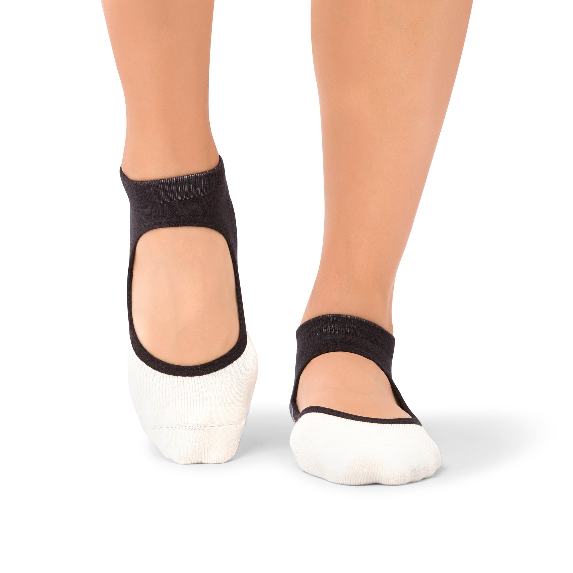 Woman stretching in a Dubai yoga studio wearing Aya Midnight Ombre grip socks