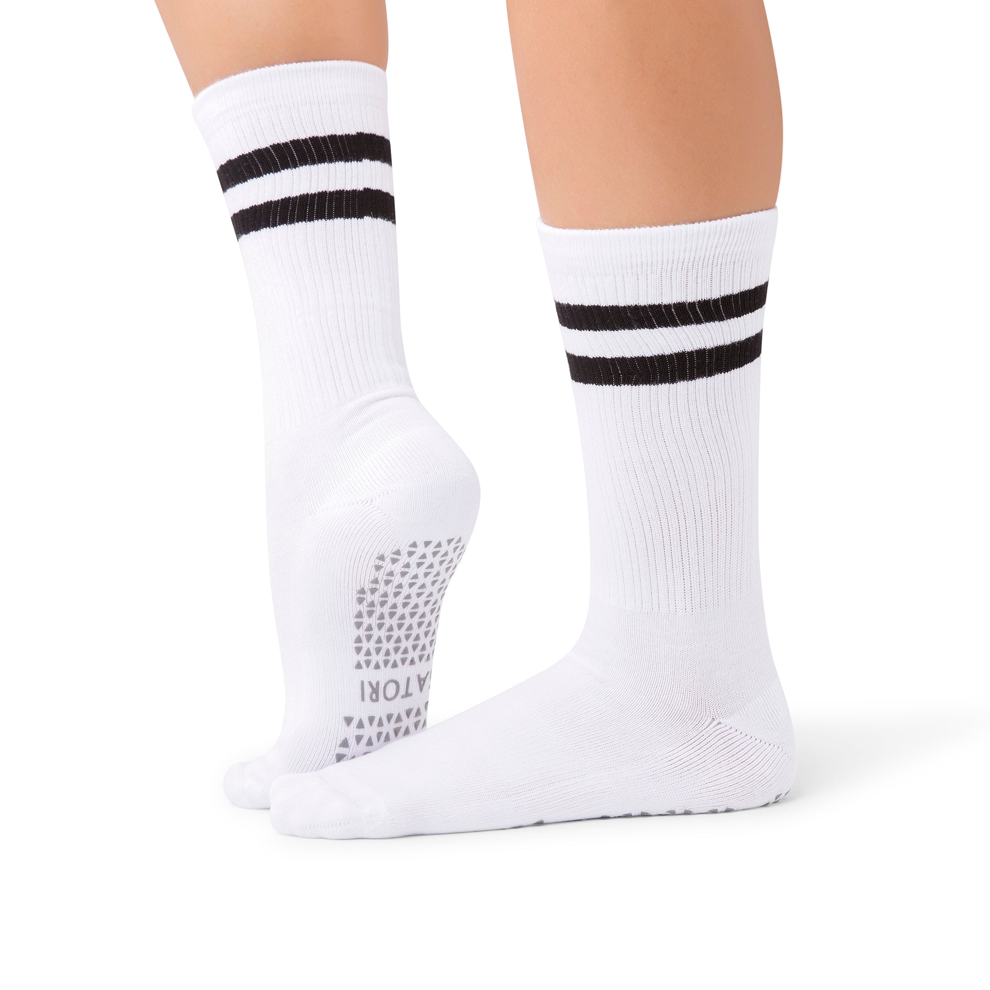 Mio Ivory Luxe grip socks in a Abu Dhabi barre studio setting
