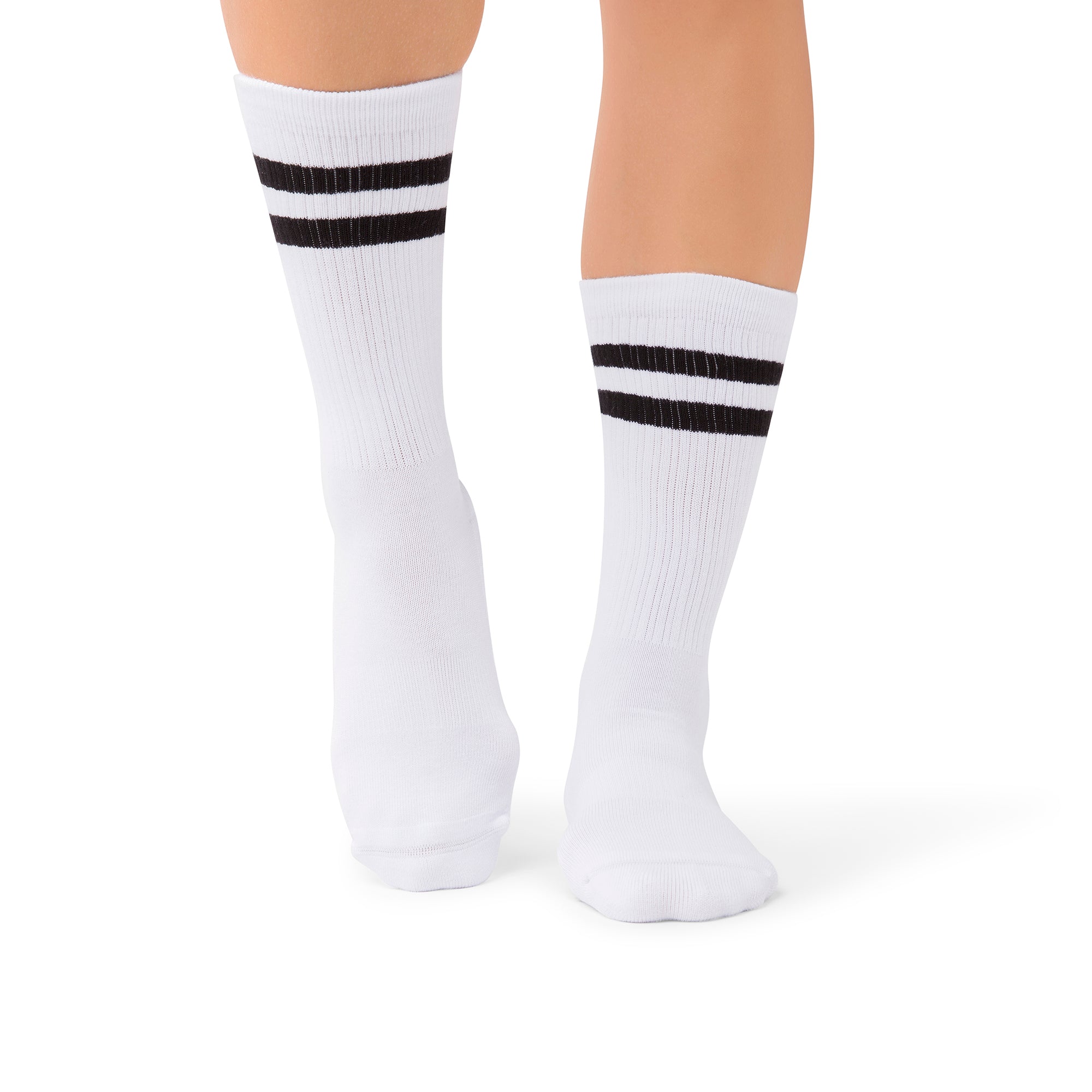 Mio Ivory Luxe grip socks in a Middle East barre studio setting
