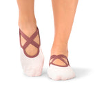 Naomi Acai Berry Ombre grip socks on woman’s feet during Pilates class in the Middle East