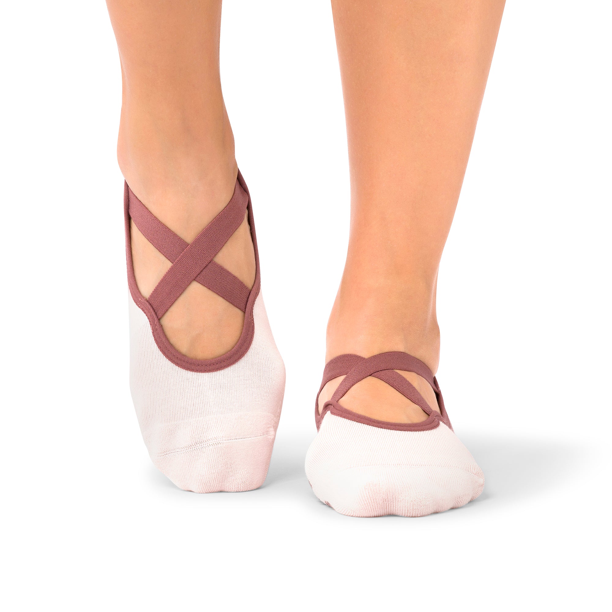 Naomi Acai Berry Ombre grip socks on woman’s feet during Pilates class in the Middle East