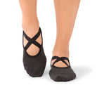 Close-up of Naomi Anthracite grip socks worn during a barre class in a UAE studio