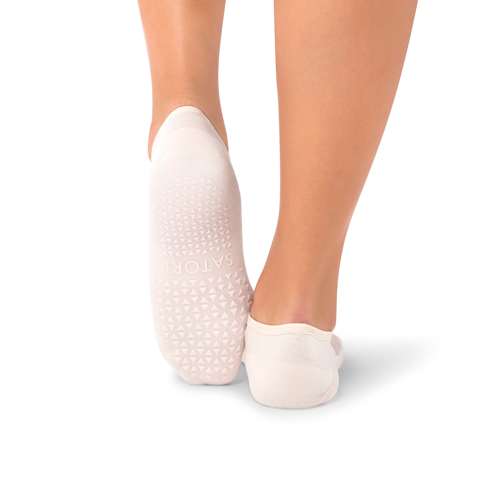 Sora ivory blush yoga grip socks showing arch band support and non-slip sole for studio workouts